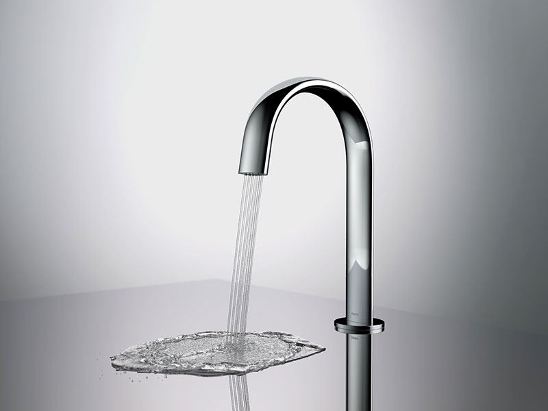 TOTO’s Gooseneck Touchless Faucet with ECOPOWER® technology spills a steady stream of water onto a reflective surface.
