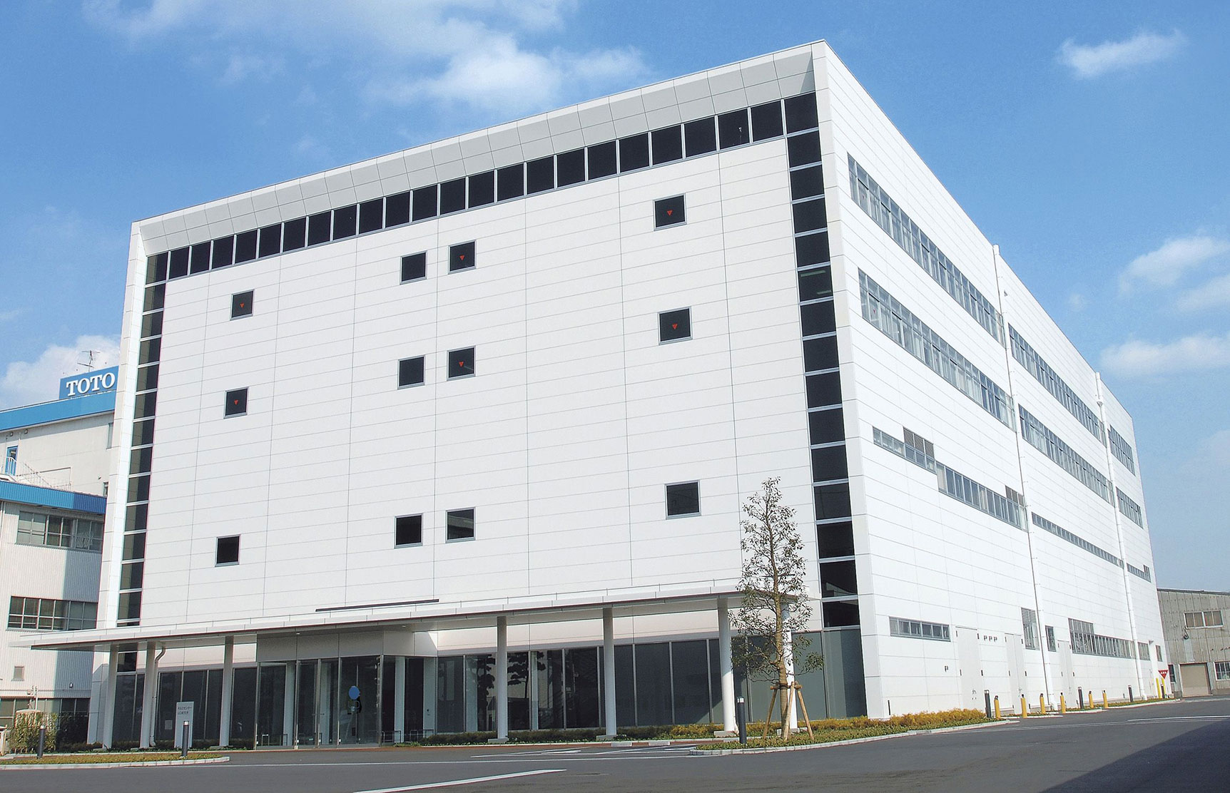 The exterior of the TOTO Universal Research Design Center located in Kanagawa Prefecture, Japan.